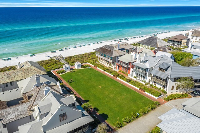 aerial view featuring a view of the beach and a water view