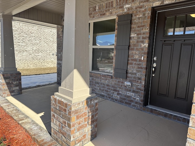 doorway to property with a porch