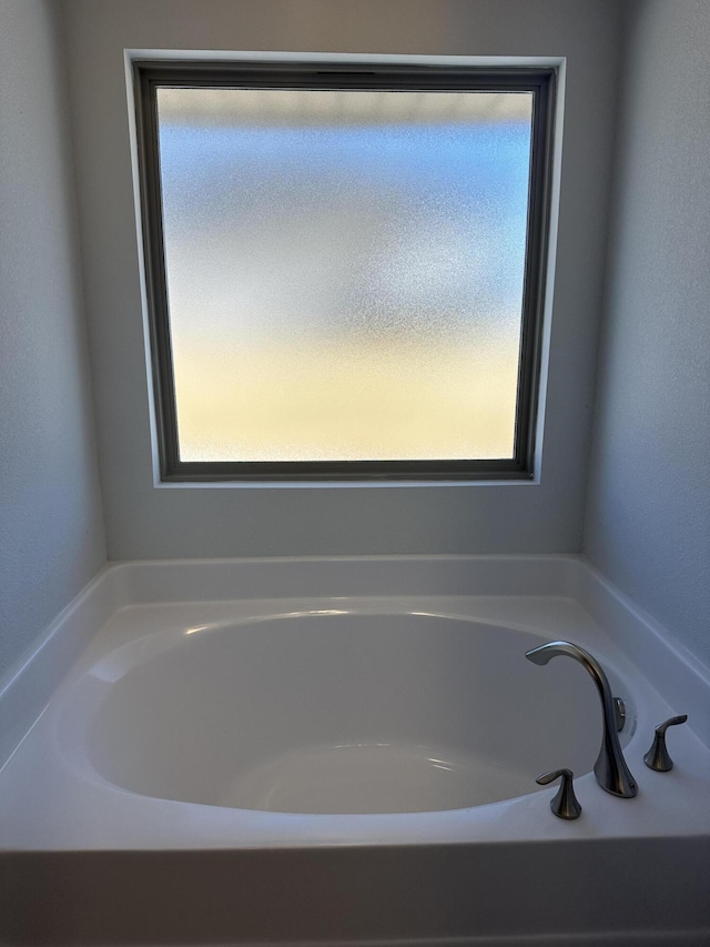 bathroom featuring a tub to relax in