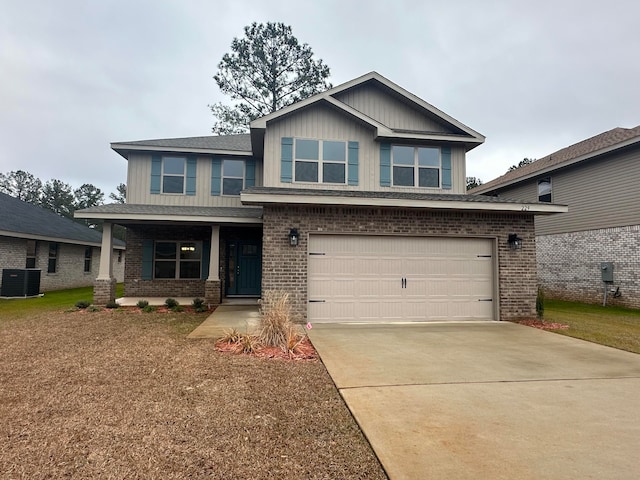 view of front of home with central AC and a garage