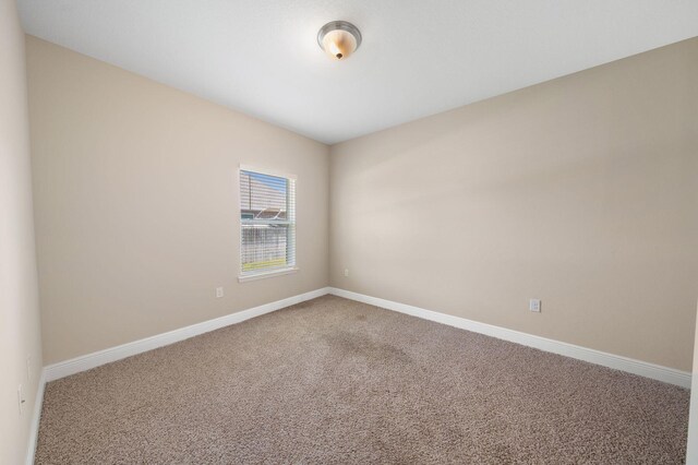 empty room with carpet flooring