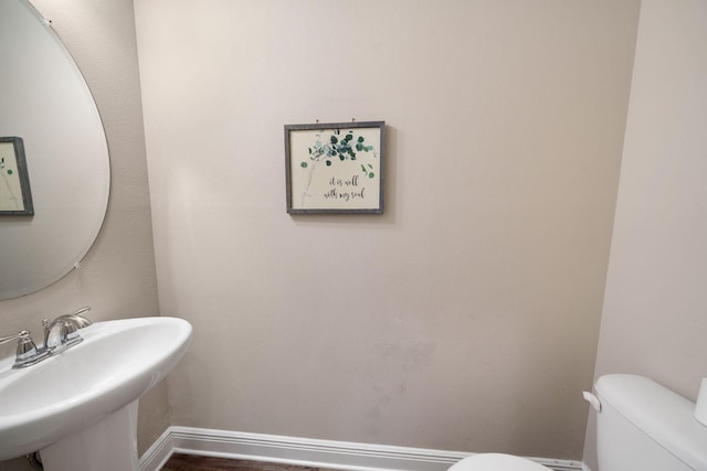 bathroom with sink and toilet