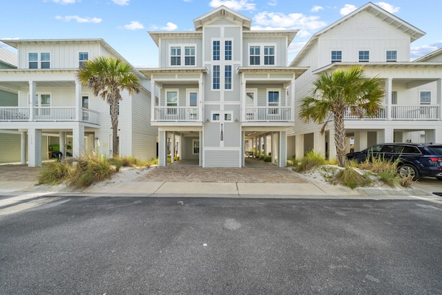 view of front of property with a balcony and a carport