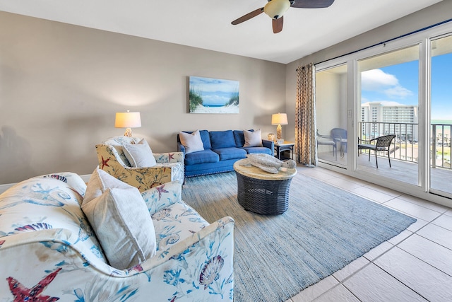 living room featuring ceiling fan and light tile patterned floors