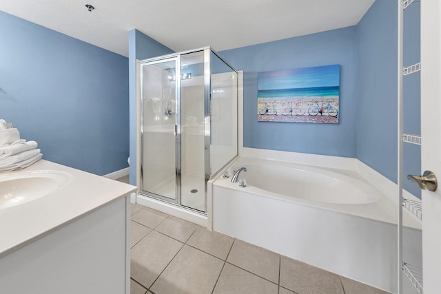 full bathroom with vanity, a shower stall, a bath, and tile patterned floors