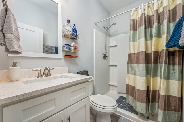 bathroom with vanity, toilet, and a shower with shower curtain