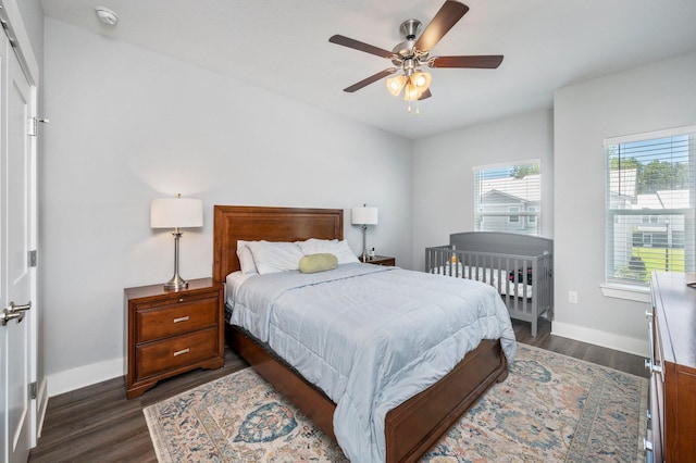 bedroom with ceiling fan and dark hardwood / wood-style flooring