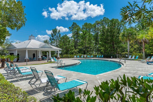 view of swimming pool featuring a patio area