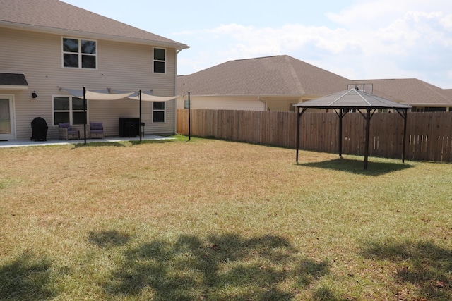 view of yard featuring a gazebo and a patio area