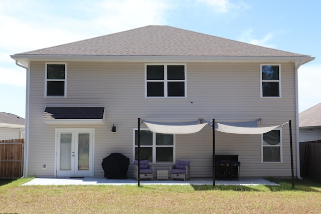 rear view of property with a yard, a patio area, french doors, and an outdoor hangout area