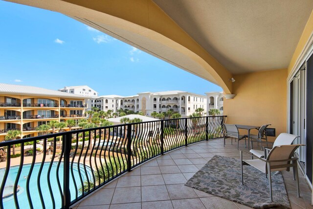 balcony featuring a community pool