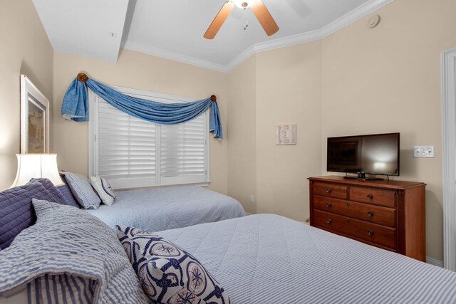 bedroom with ceiling fan and crown molding