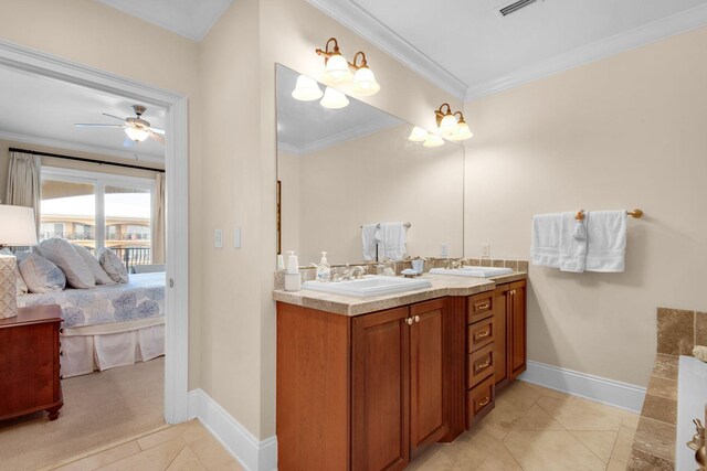 bathroom with ceiling fan, crown molding, tile patterned floors, and vanity