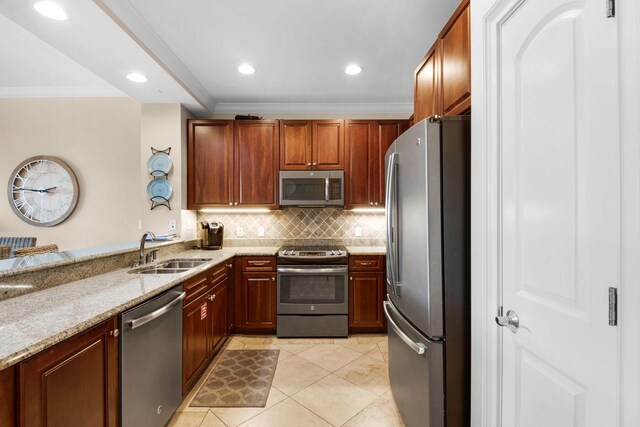 kitchen featuring sink, ornamental molding, appliances with stainless steel finishes, light stone countertops, and light tile patterned floors