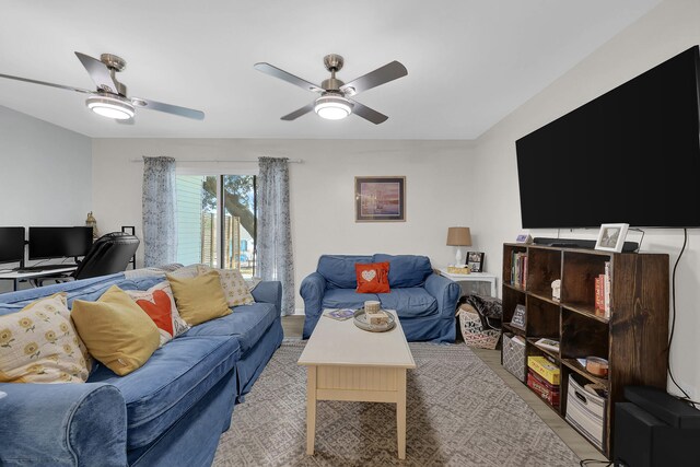 living room featuring light wood-type flooring and ceiling fan