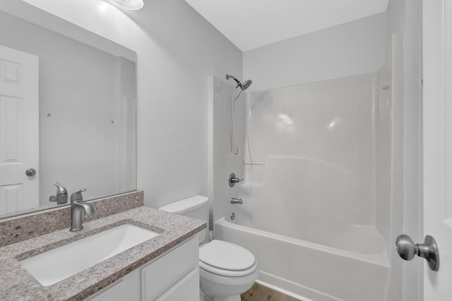 full bathroom with vanity, toilet, wood-type flooring, and shower / bath combination