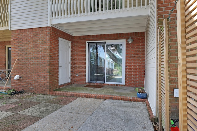 entrance to property with a patio area