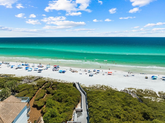 birds eye view of property featuring a water view and a view of the beach