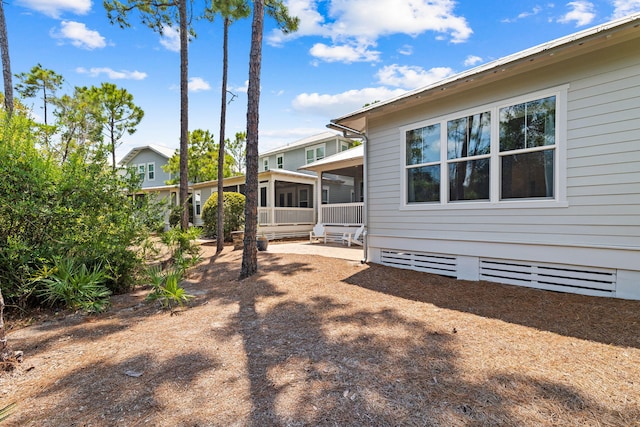 view of yard featuring a sunroom