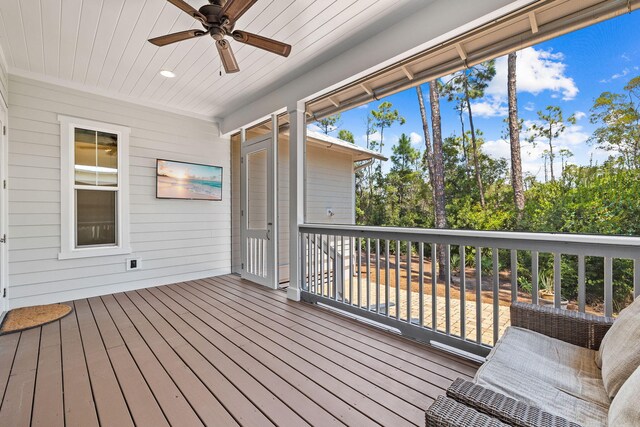 wooden terrace featuring ceiling fan