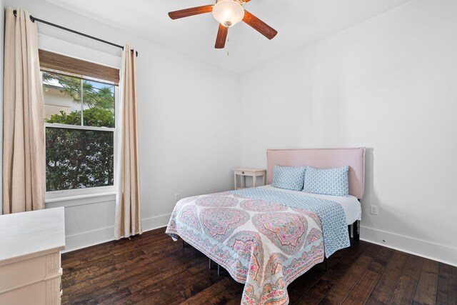 bedroom featuring dark hardwood / wood-style flooring and ceiling fan