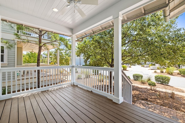 wooden deck featuring ceiling fan