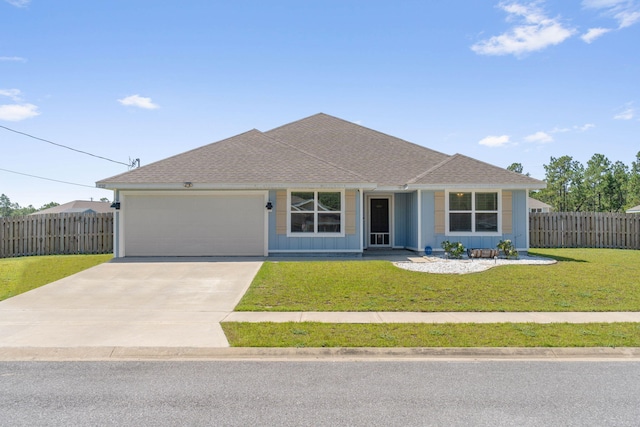 ranch-style house featuring a garage and a front lawn