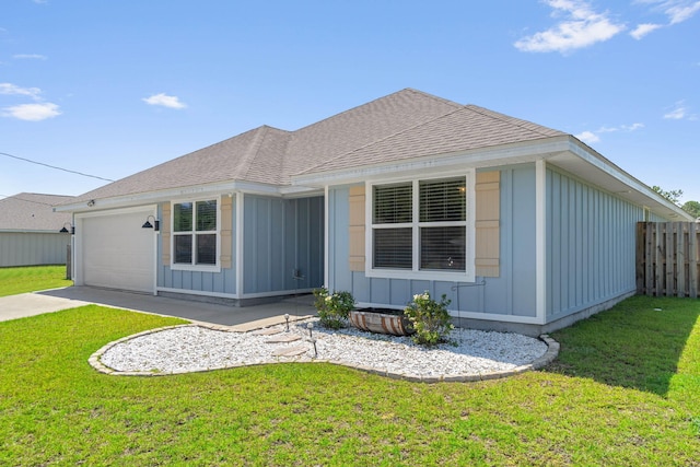 view of front facade with a garage and a front lawn