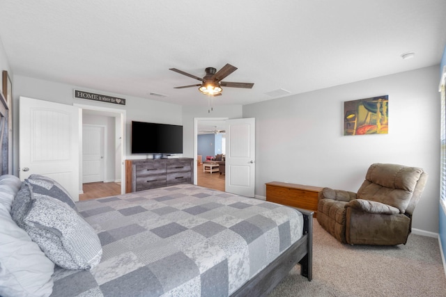 bedroom with ceiling fan and light wood-type flooring