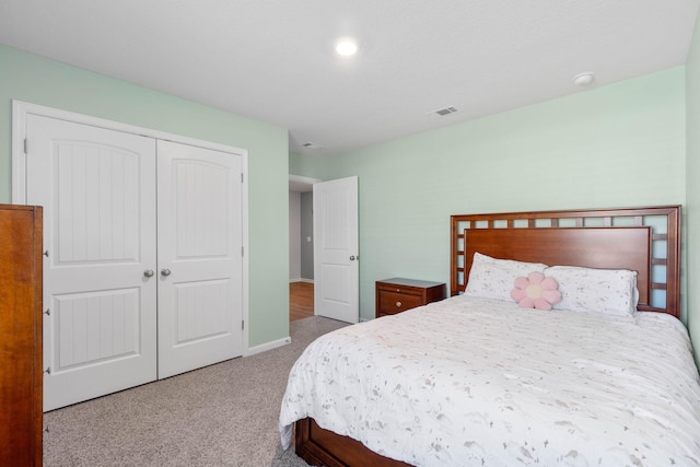 carpeted bedroom featuring a closet