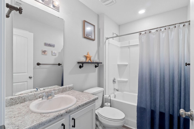 full bathroom with toilet, vanity, and shower / tub combo