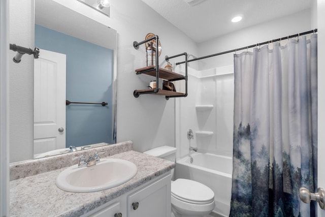 full bathroom featuring a textured ceiling, shower / tub combo with curtain, toilet, and vanity