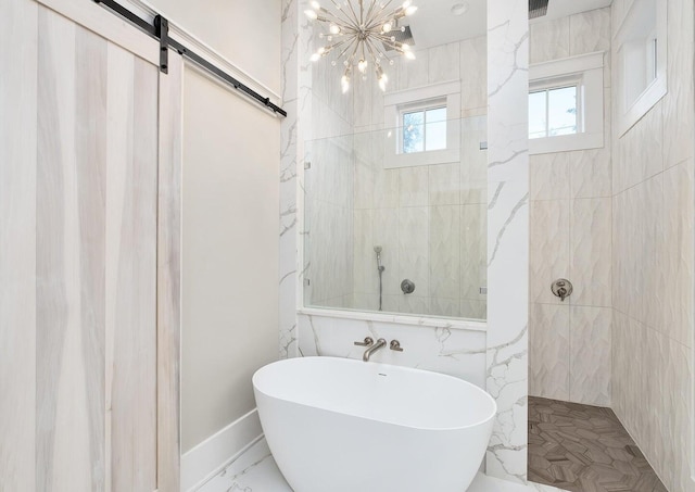 bathroom featuring independent shower and bath and a notable chandelier