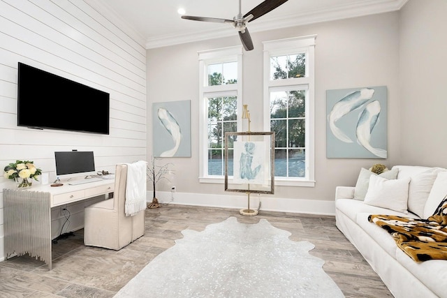 home office featuring crown molding, ceiling fan, and light hardwood / wood-style flooring