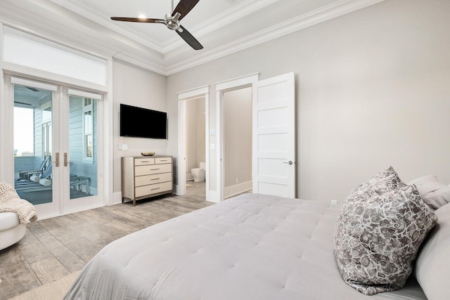 bedroom featuring access to exterior, crown molding, ceiling fan, french doors, and hardwood / wood-style flooring