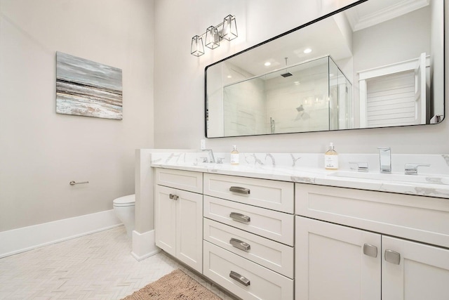 bathroom with parquet flooring, walk in shower, crown molding, vanity, and toilet