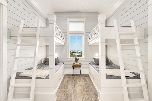 walk in closet with wood-type flooring