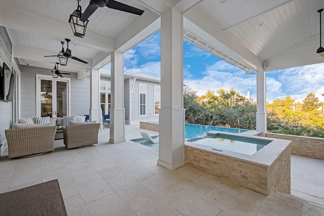 view of patio with ceiling fan, a swimming pool with hot tub, and an outdoor living space