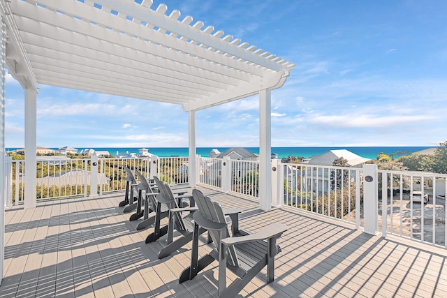 deck featuring a pergola and a water view