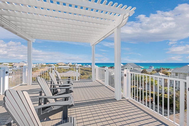 view of patio featuring a water view and a pergola