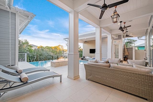 view of patio with ceiling fan and outdoor lounge area