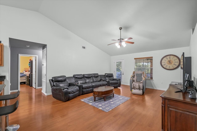 living room featuring ceiling fan, high vaulted ceiling, and hardwood / wood-style floors