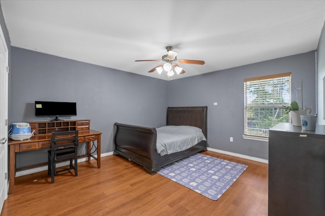 bedroom featuring ceiling fan and wood-type flooring