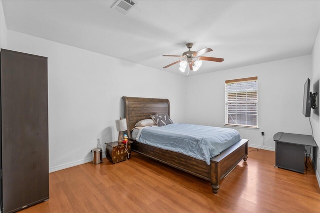 bedroom featuring ceiling fan and light hardwood / wood-style flooring