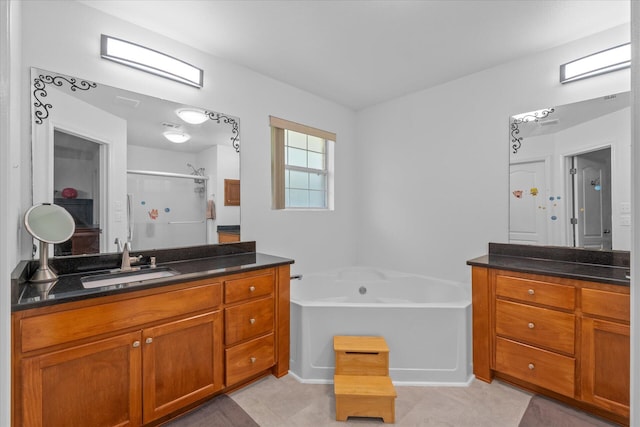 bathroom featuring tile patterned flooring, plus walk in shower, and vanity