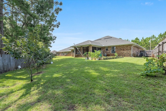 2458 Abaco Dr, Navarre, FL 32566 - view of yard with central AC and a fenced backyard