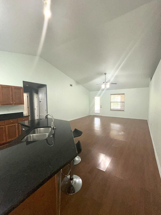 2458 Abaco Dr, Navarre, FL 32566 - interior space with dark countertops, wood finished floors, a sink, ceiling fan, and lofted ceiling
