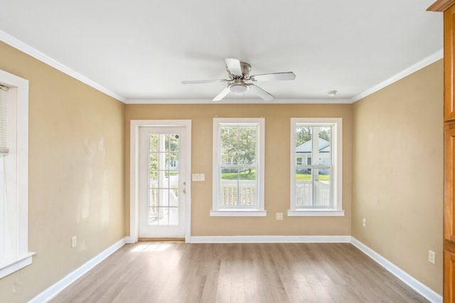 interior space featuring light hardwood / wood-style floors, plenty of natural light, ceiling fan, and ornamental molding