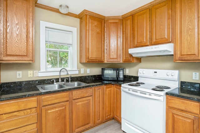 kitchen featuring sink, dark stone countertops, light hardwood / wood-style flooring, white range with electric stovetop, and crown molding