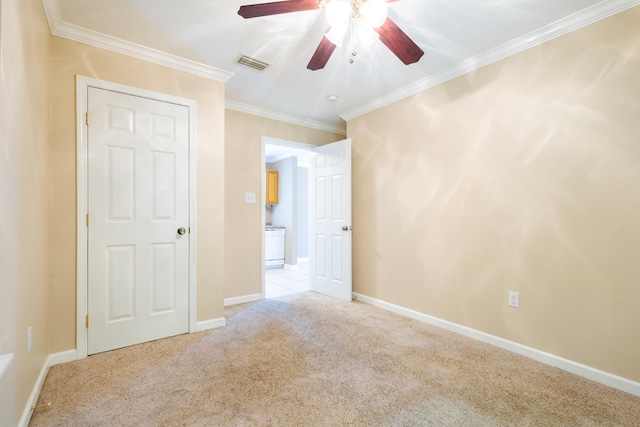 unfurnished bedroom featuring ceiling fan, light carpet, and ornamental molding